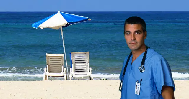 10639-empty-beach-chairs-and-umbrella-overlooking-the-ocean-pv