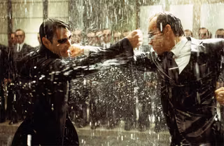 The Matrix movie image Keanu Reeves as Neo fighting The Matrix movie image Hugo Weaving Agent Smith