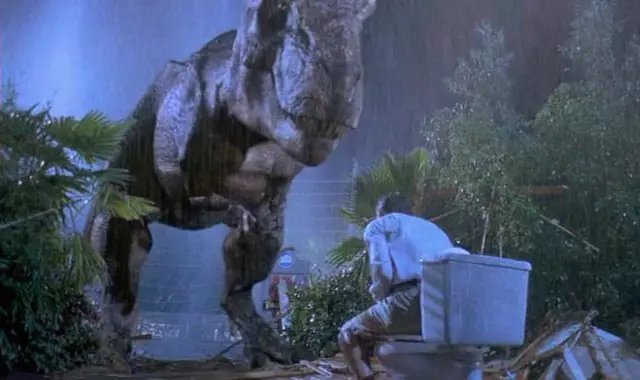 Martin Ferrero (Donald Gennaro) is hiding in the portable bathroom.